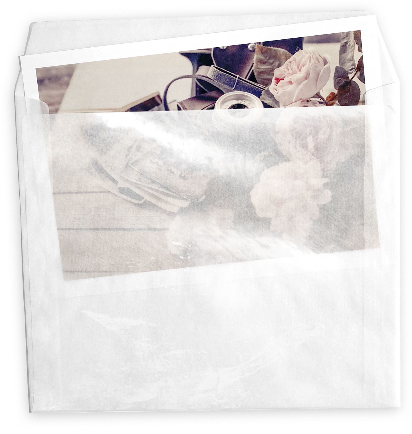 Photo sticking out of and partially visible inside glassine paper envelope.