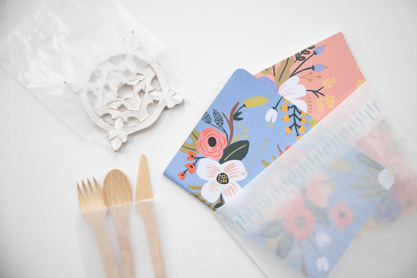 Three different size glassine envelopes holiding different items. 